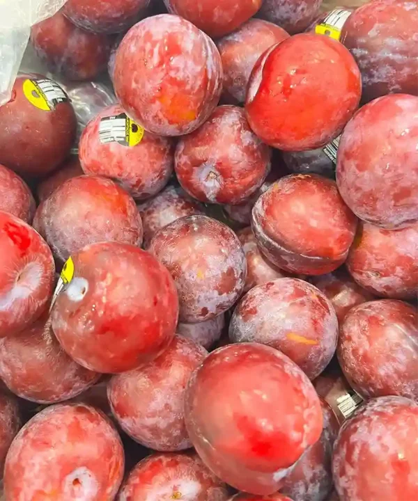 Fresh Plum cut open showing juicy flesh - Fruitlandbd